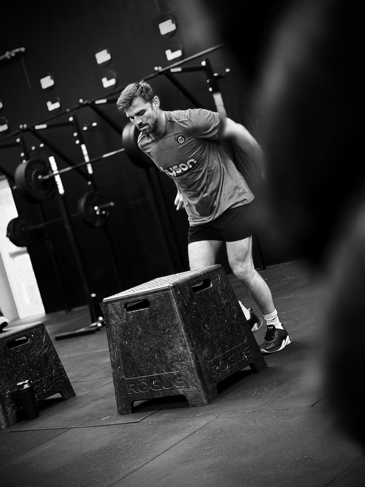 A member on the air bike in a CrossFit class at Huntsman