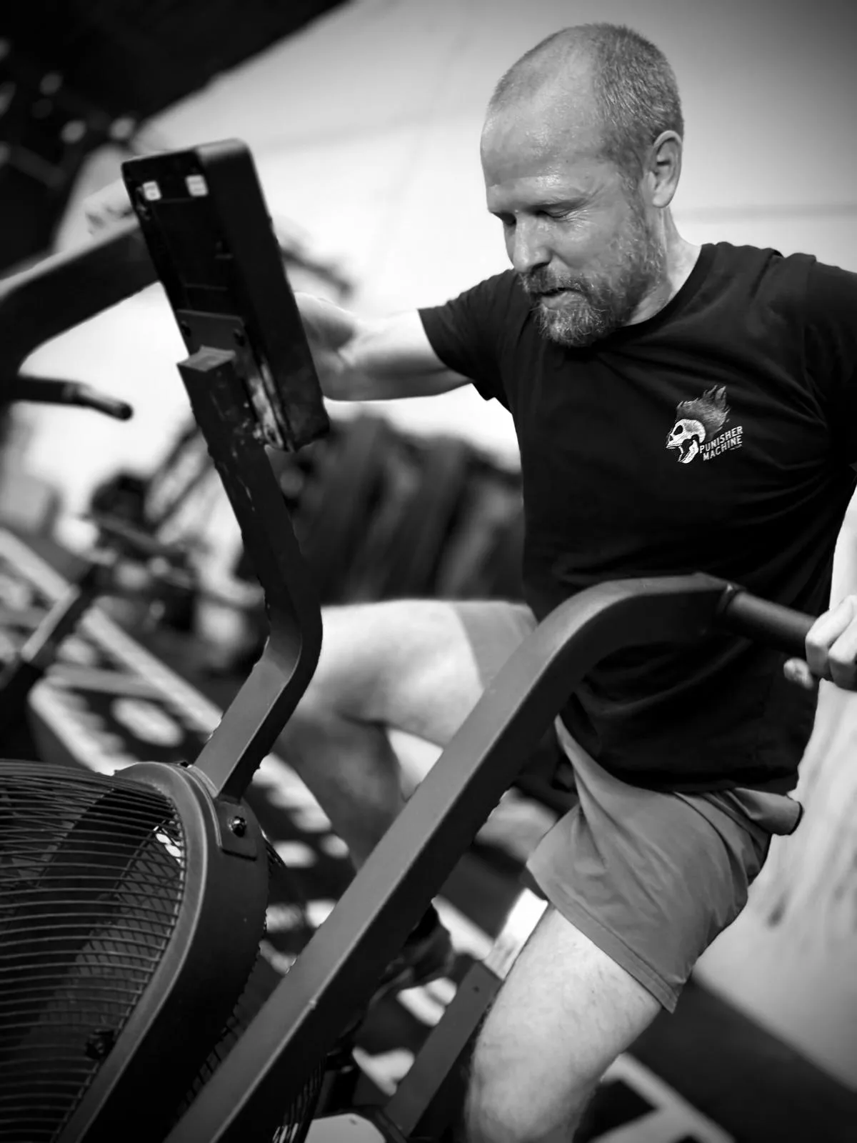 A member on the air bike in a CrossFit class at Huntsman